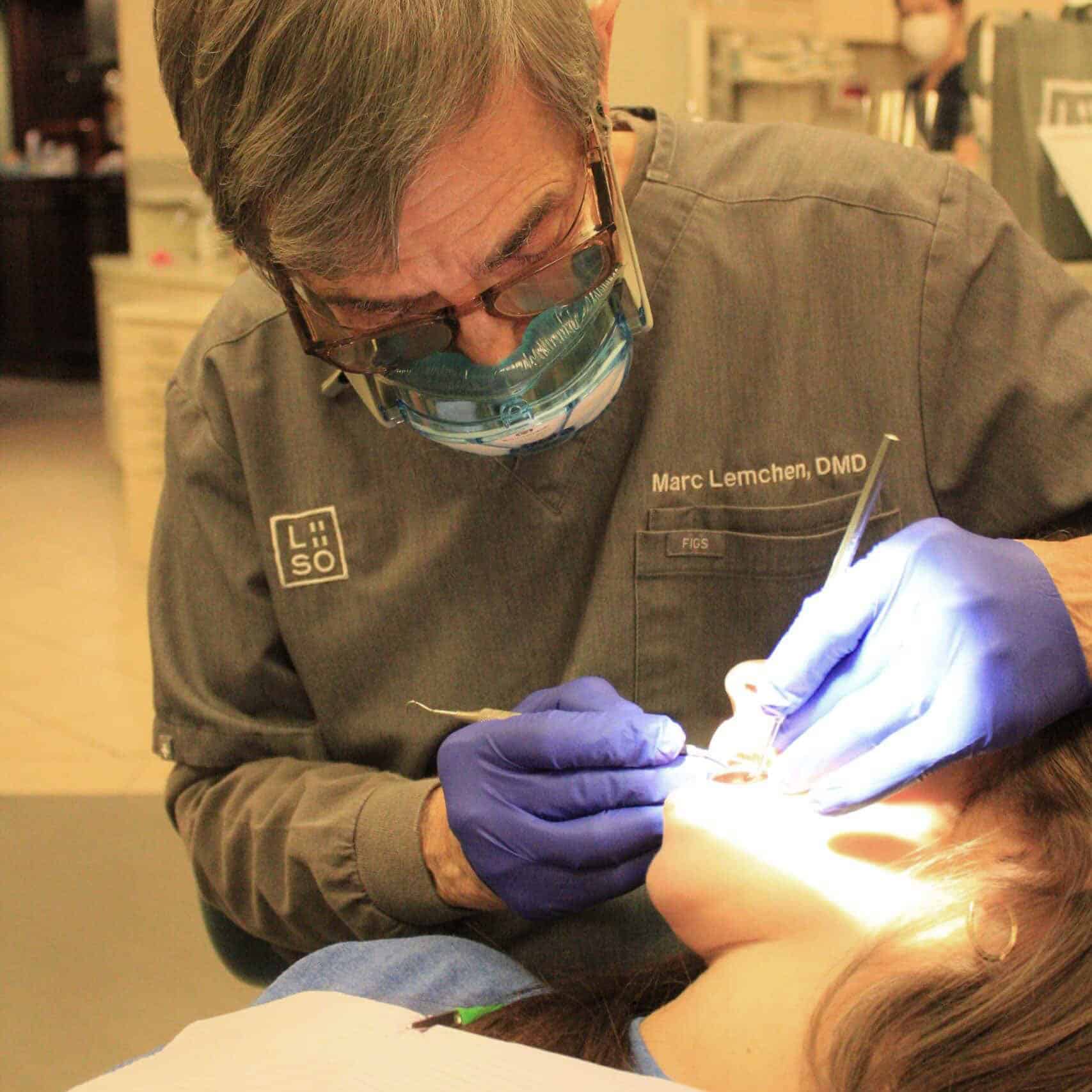 Orthodontist examining a patient for bite correction, one of the premium orthodontic treatments NYC families choose at our Manhattan office