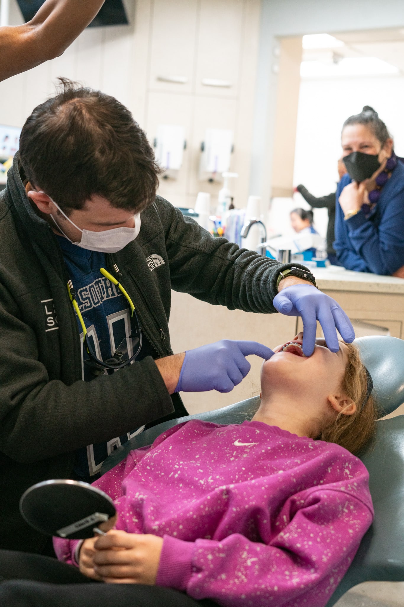 Orthodontist explaining crossbite treatment NYC options to a patient using a 3D digital scan