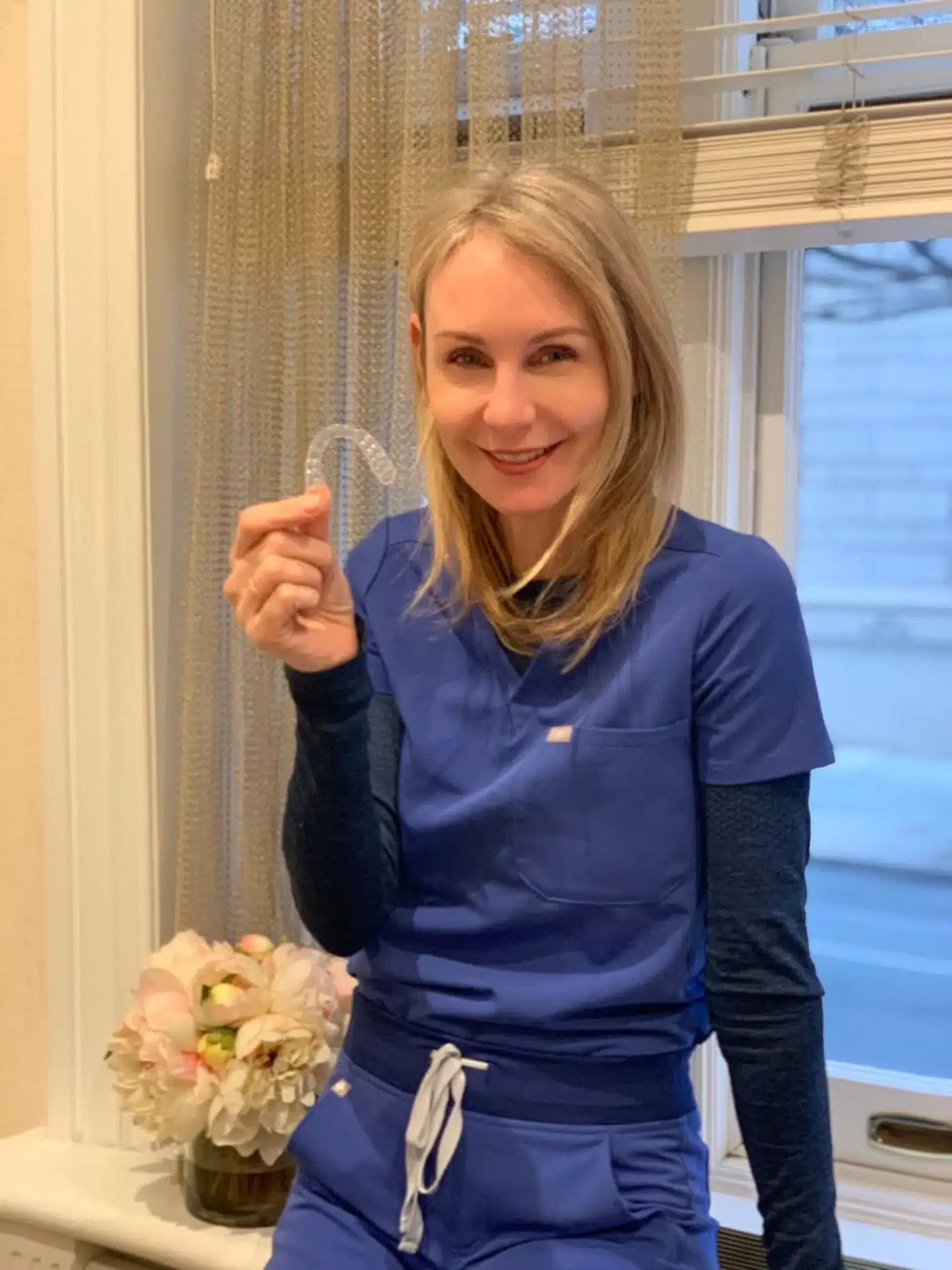 Patient reviewing premium orthodontic treatments NYC options with her doctor at Lemchen Salzer Orthodontics
