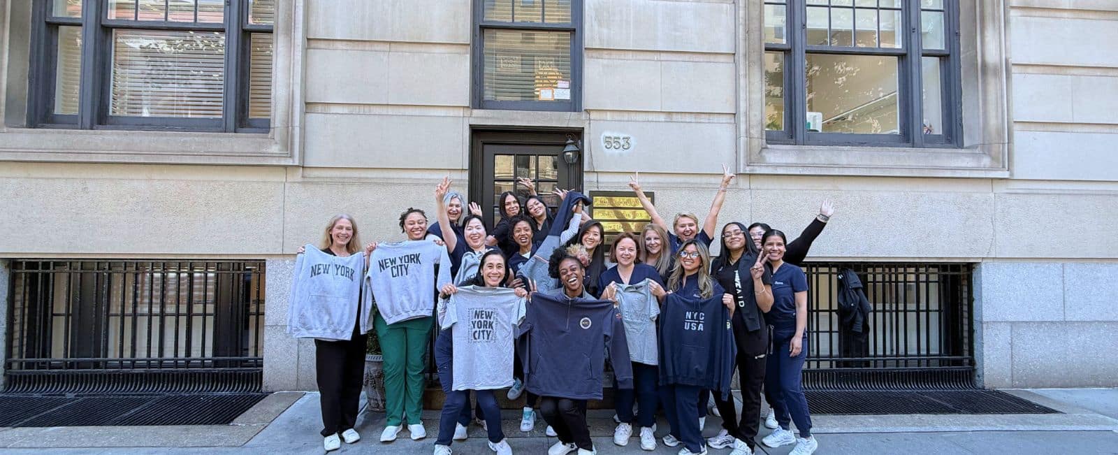 Lemchen Salzer Orthodontics team gathered outside their Park Avenue orthodontist office in New York City